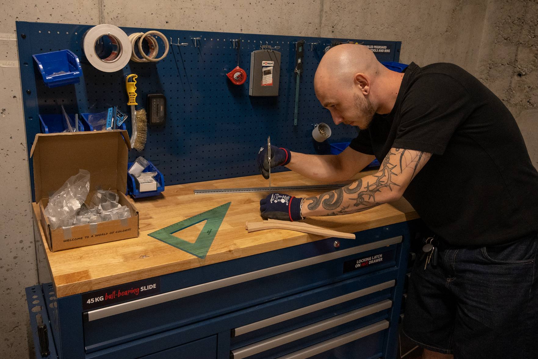 mkt team member assembling 3D-printed parts at a workbench