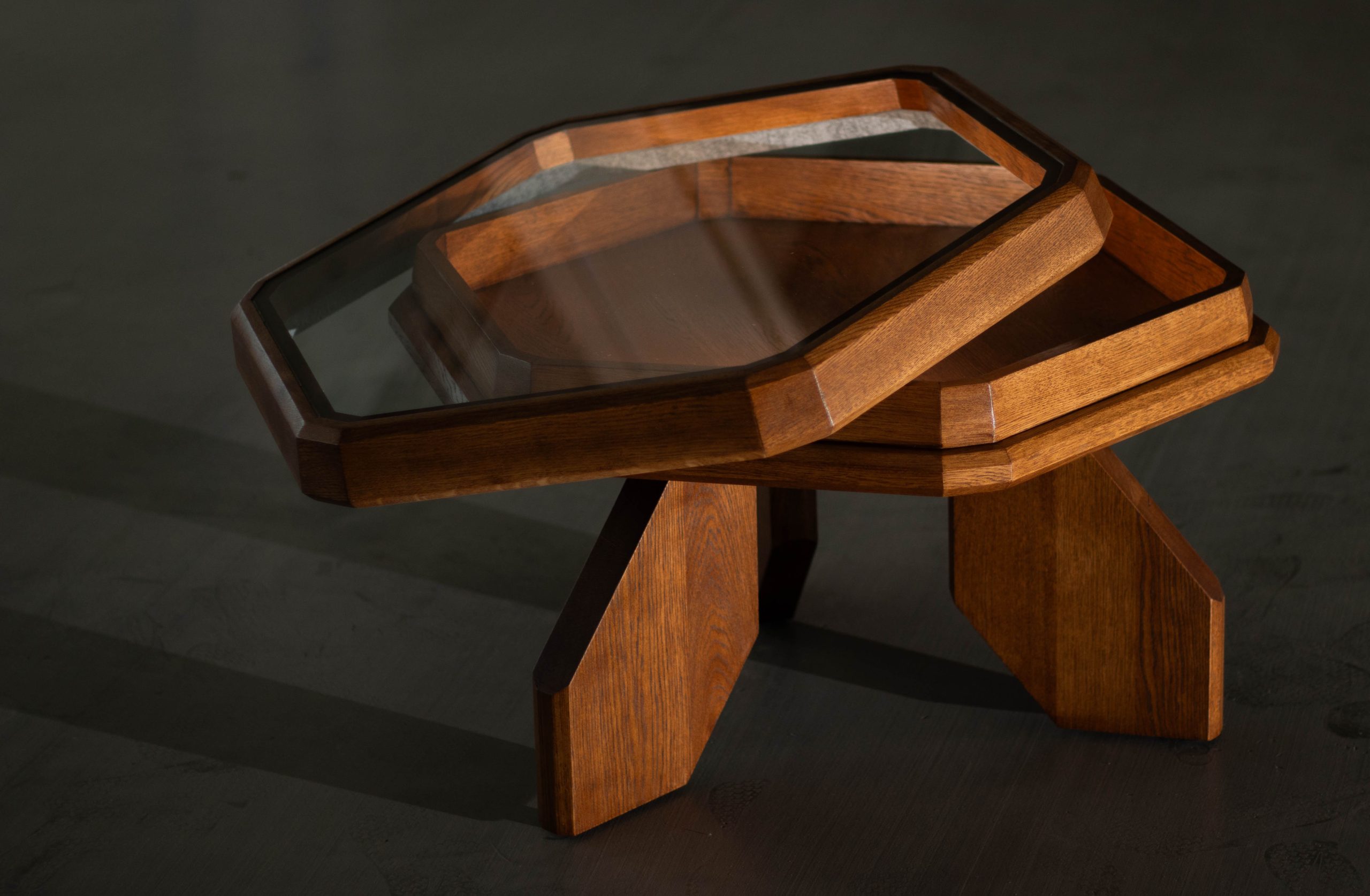 Fagora® sculptural table with solid wood legs and hexagonal glass top