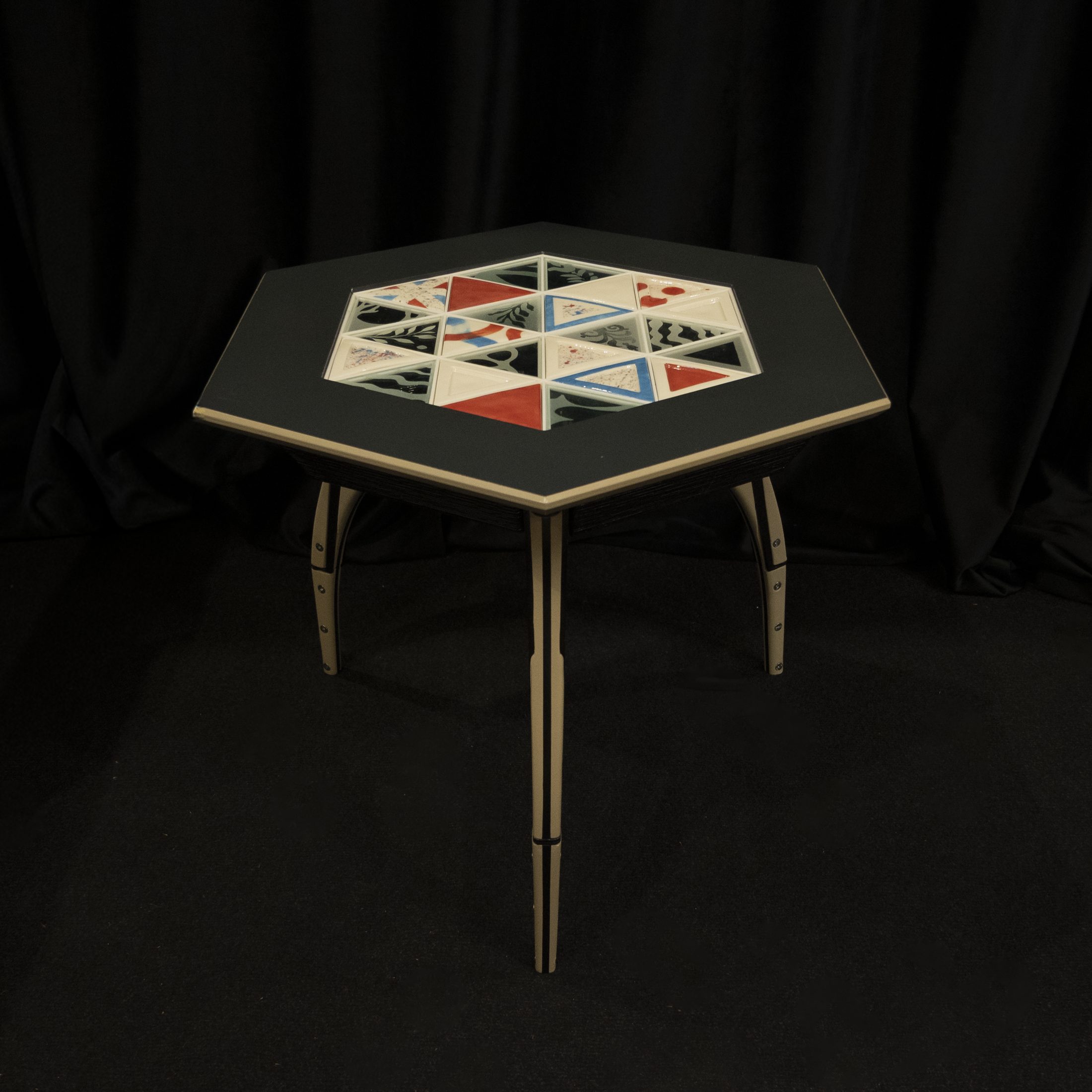 Lumvia table with triangular inlaid top, angled view