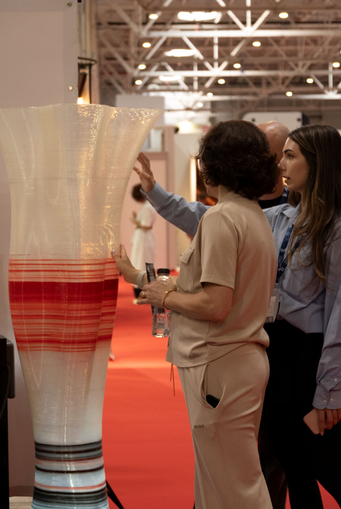 women touching noxia 3d printed lamp at BifeSim 2026