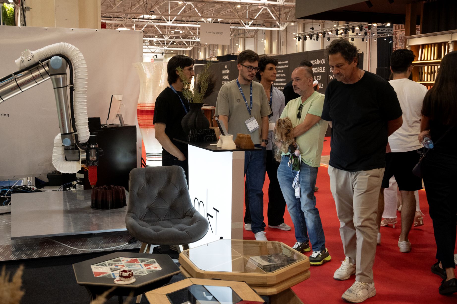 People at BifeSim stand 2026 viewing 3D printing robot